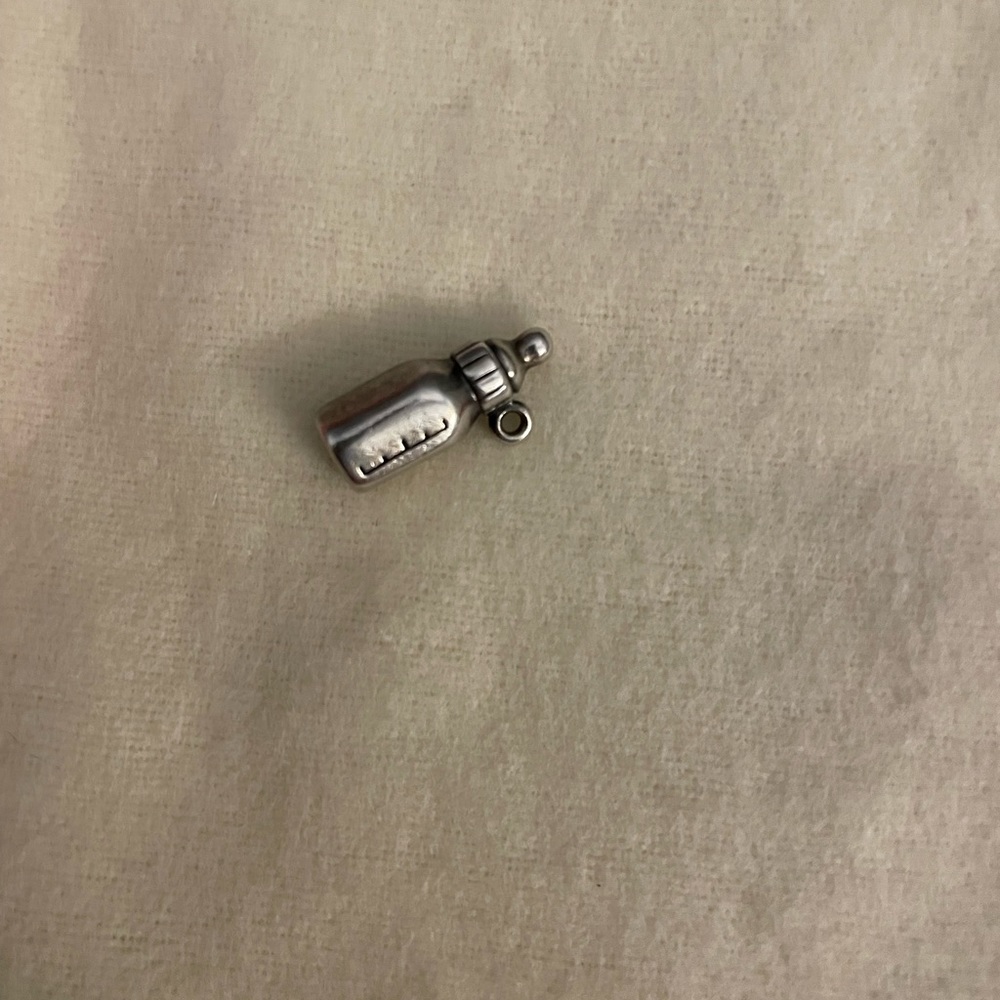 Retired James Avery baby bottle charm